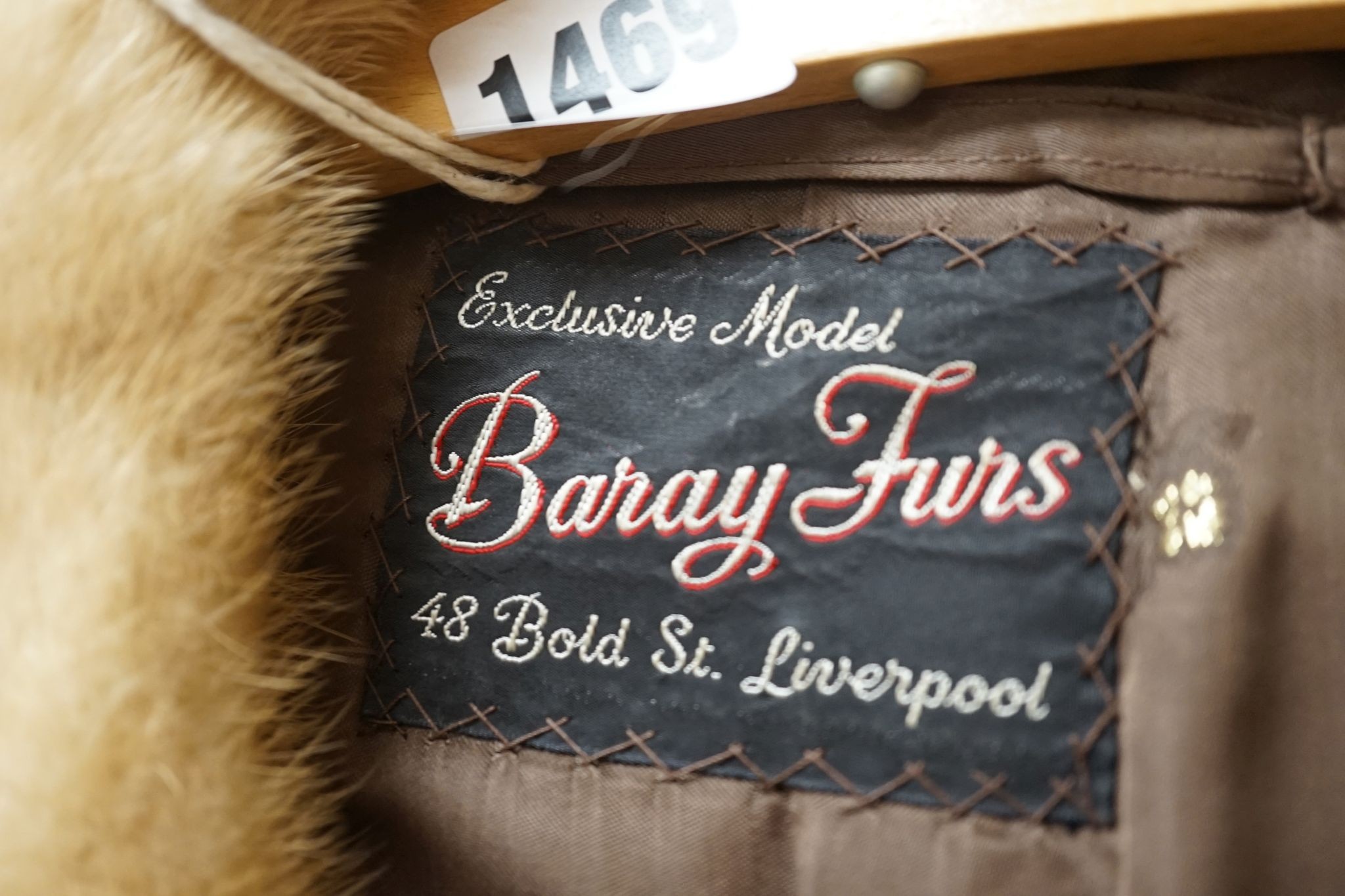 A ladies dark brown squirrel coat with blond mink collar by Baray Furs.